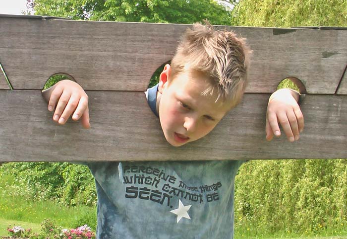 My son Tim hamming it up in the stocks with a desperate 'not another tomato' look on his face! The t-shirt reads 'Perceive those things which cannot be seen'