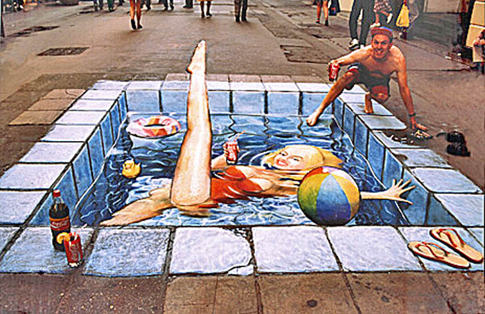 The same pavement drawing viewed this time from the correct perspective reveals a girl in a red swimsuit lying in a swimming pool.