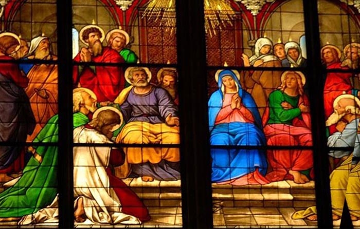 A photo of the stained glass window in Cologne cathedral showing the day of Pentecost and tongues of fire on the disciples